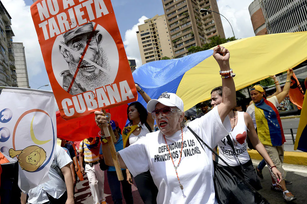 People march during a protest against the government of Venezuelan President Nicolas Maduro, in Caracas on Oct. 18, 2014. Public unrest is growing in Venezuela. (Federico Parra/AFP/Getty Images)