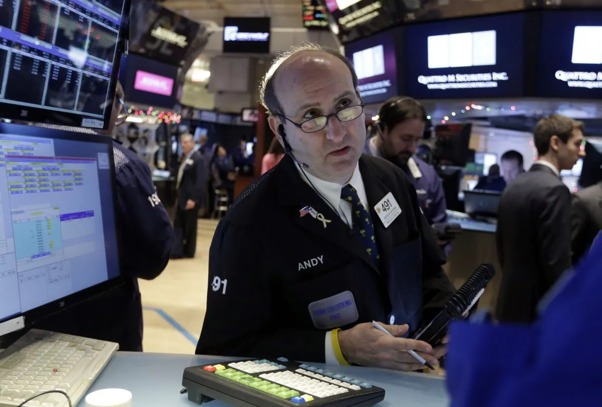 Trader Andrew Silverman works on the floor of the New York Stock Exchange Tuesday, Jan. 6, 2015. (AP Photo/Richard Drew)