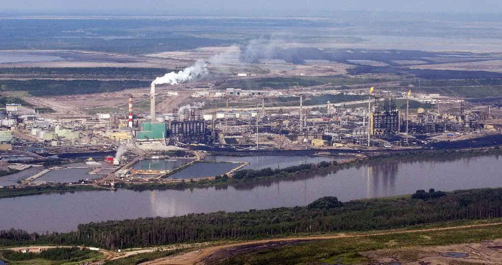 An aerial view of the Suncor mine facility along the Athabasca river near Fort McMurray, Alta., in a file photo. (The Canadian Press/Jeff McIntosh)