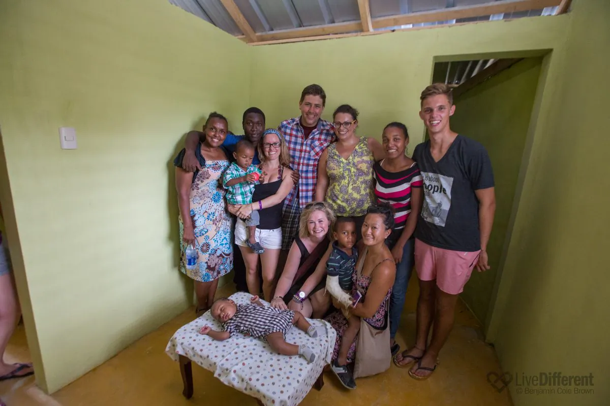 Boston Pizza employees pose with beneficiaries in one of three homes they built in the Dominican Republic in 2014, in partnership with the charity Live Different. (Courtesy Boston Pizza)