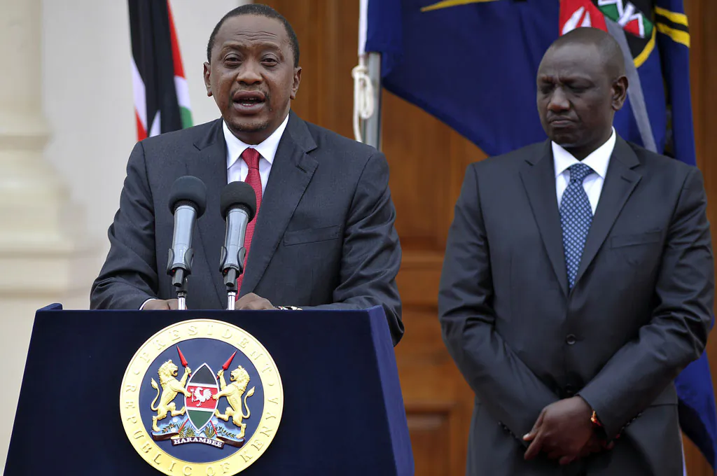 Kenyan President Uhuru Kenyatta delivers his state of the nation speech next to Vice President William Ruto (R) at the State House in Nairobi on Dec. 2, 2014. (Simon Maina/AFP/Getty Images)