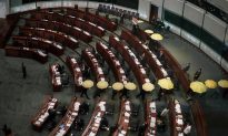 Hong Kong: Pro-Democracy Lawmakers Unfurl Yellow Umbrellas in Council Boycott
