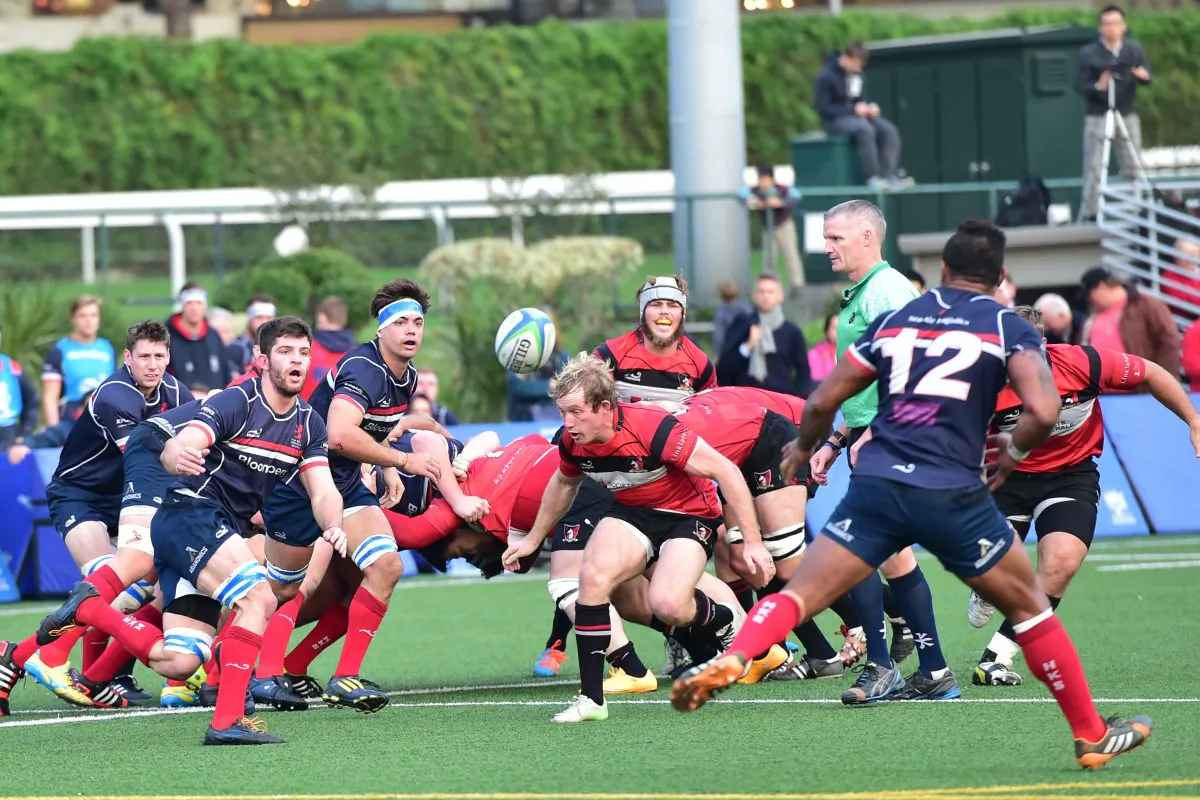 Action in the match between Societe Generale Valley and Bloomberg HK Scottish in their fixture at Happy Valley on Dec 13, 2014. (Bill Cox/Epoch Times)
