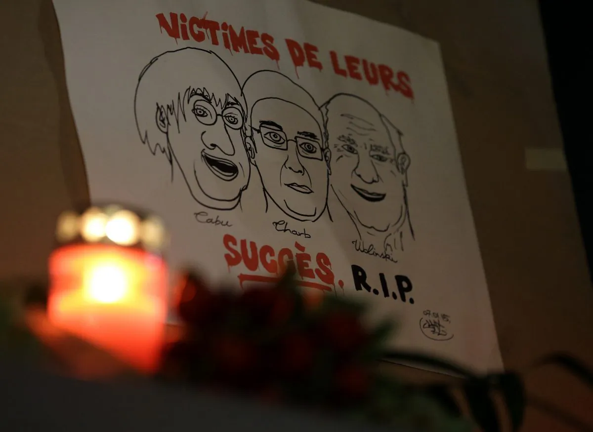 A drawing depicting cartoonist Jean Cabut (L), Charlie Hebdo editor Stephane Charbonnier (C), and cartoonist Georges Wolinski, all three of whom were killed when masked gunmen stormed the Paris offices of a weekly newspaper Charlie Hebdo and reading in French, "Victims of their success, R.I.P", is placed outside the French Embassy as people gather to express solidarity with victims of the attack in Berlin, Germany, Wednesday, Jan. 7, 2015. Three masked gunmen shouting “Allahu akbar!” stormed the Paris offices of a satirical newspaper Wednesday, killing 12 people, including its editor, before escaping in a car. It was France's deadliest postwar terrorist attack. (AP Photo/Michael Sohn)