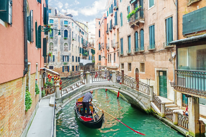 Canal in Venice, Italy via Shutterstock*