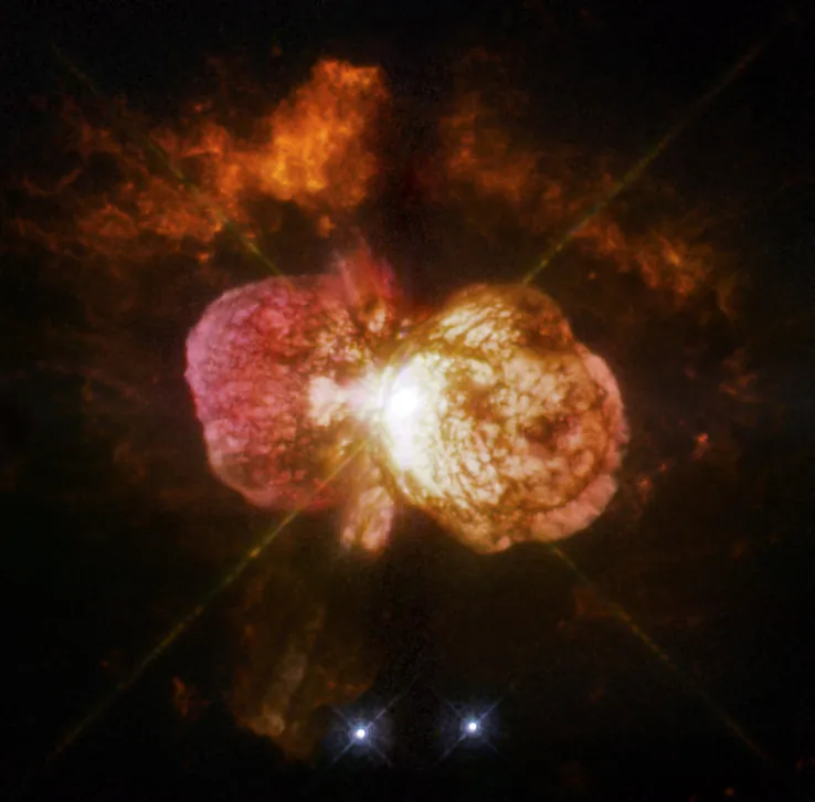 Eta Carinae's great eruption in the 1840s created the billowing Homunculus Nebula, imaged here by Hubble. Now about a light-year long, the expanding cloud contains enough material to make at least 10 copies of our sun. Astronomers cannot yet explain what caused this eruption.
(NASA, ESA, and the Hubble SM4 ERO Team)