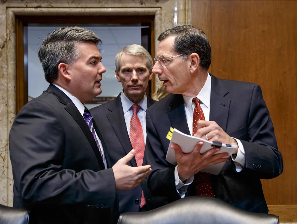 Senate Energy and Natural Resources Committee members, (L-R) Sen. Cory Gardner (R-Colo.), Sen. Rob Portman (R-Ohio), and Sen. John Barrasso (R-Wyo.) confer on Capitol Hill in Washington, Thursday, Jan. 8, 2015, as the committee crafts a markup of the long-stalled Keystone XL pipeline bill. The bill, at the top of the GOP agenda, was passed out of the committee and will go to the Senate floor for debate. (AP Photo/J. Scott Applewhite)