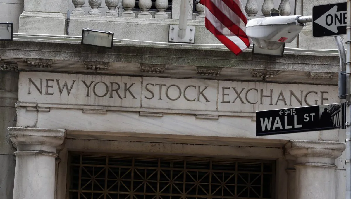 The Wall Street entrance of the New York Stock Exchange on Oct. 2, 2014. US stocks edged lower in early trading, Friday, Jan. 9, 2015, after two days of big gains. The government reported another strong round of hiring in December that helped push the unemployment rate down to a six-year low. (AP Photo/Richard Drew)