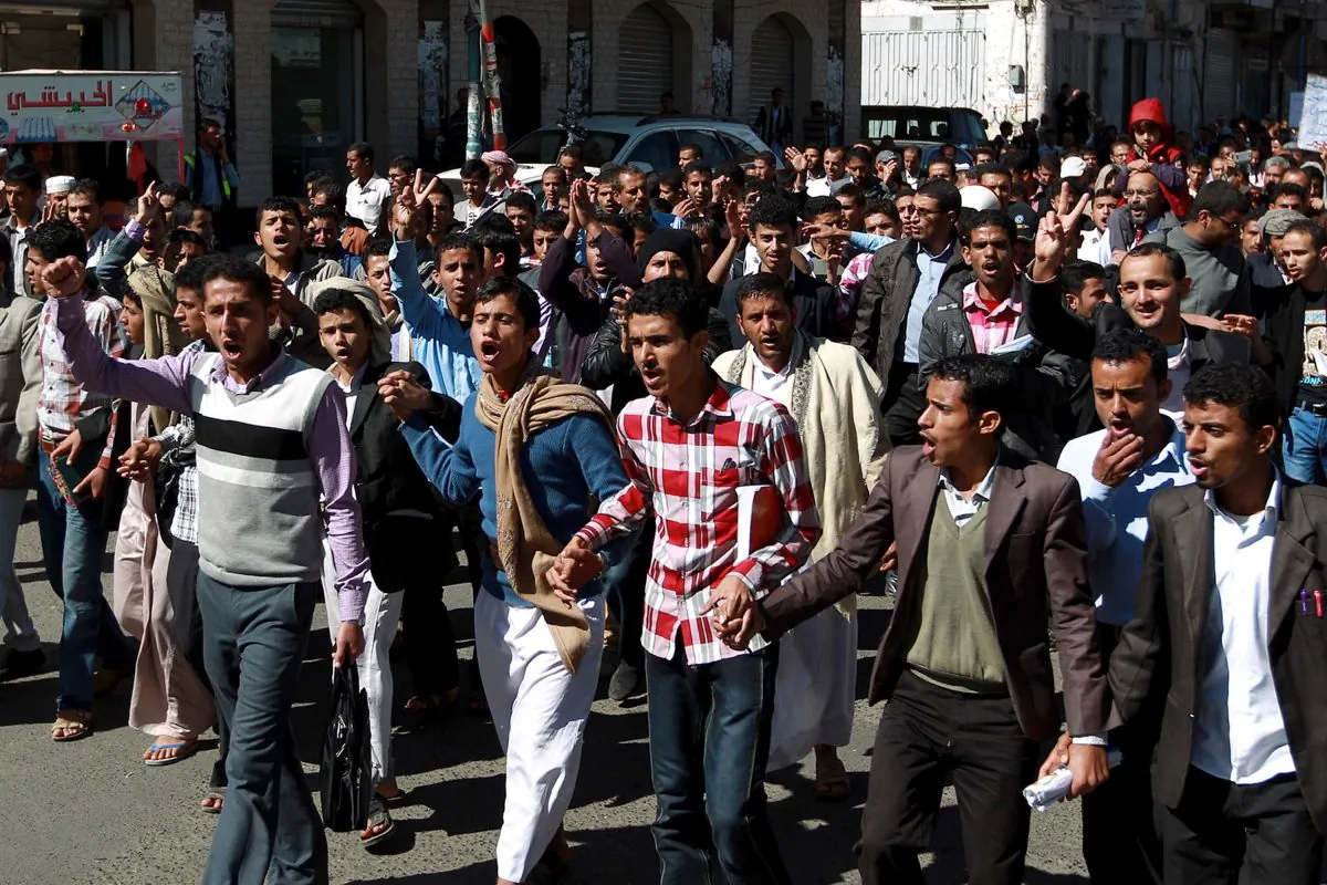Yemeni protesters shout slogans during a rally in Sanaa on Dec. 27, 2014, against the deployment of armed militias from the Shiite Houthi movement across the country and in the capital. (Mohammed Huwais/AFP/Getty Images)