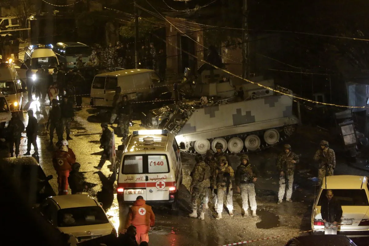 Lebanese security forces and emergency personnel gather outside a cafe targeted by a suicide bombing on Jan. 10, 2015, in the Jabal Mohsen Alawite neighbourhood of the northern city of Tripoli. Lebanon's second city Tripoli has seen frequent violence pitting gunmen in the Alawite district of Jabal Mohsen against neighbouring Sunni Bab al-Tebbaneh. (Ibrahim Chalhoub/AFP/Getty Images)