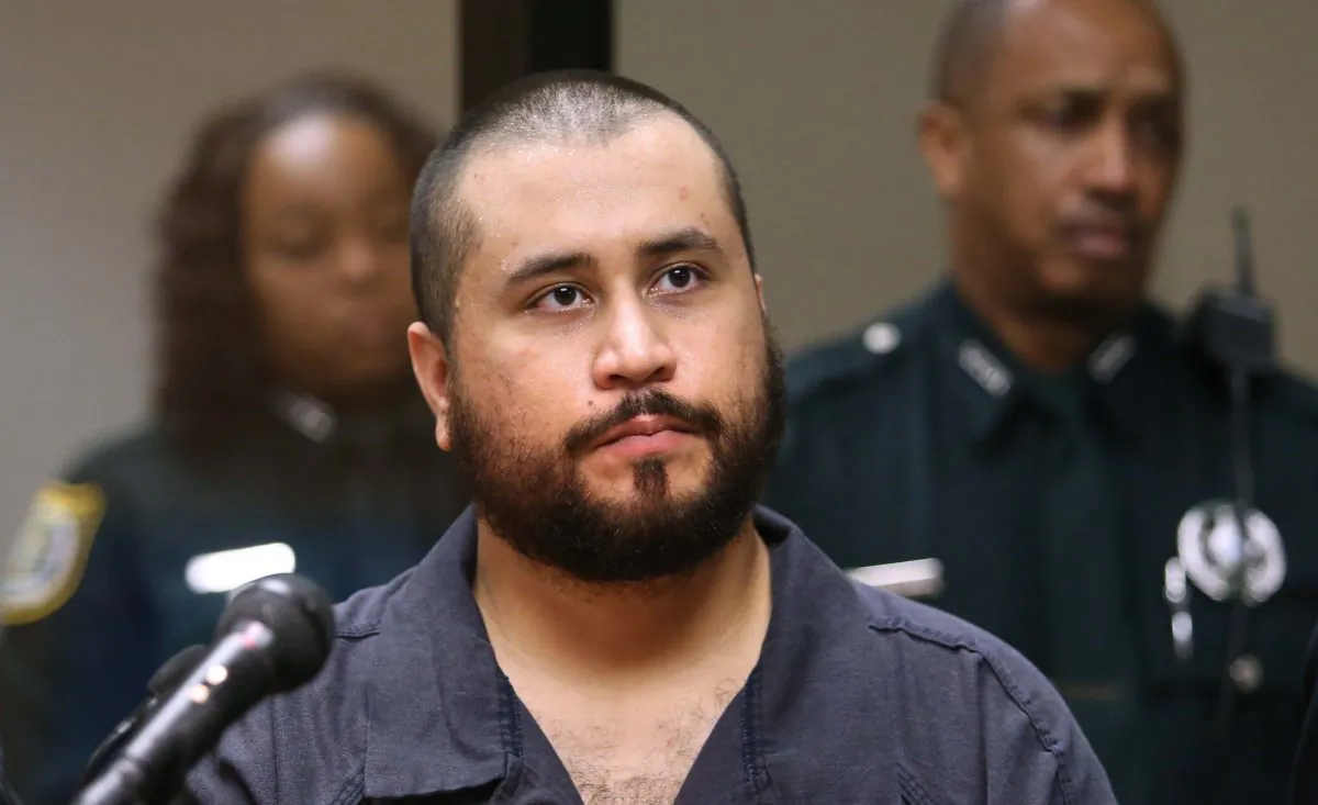 George Zimmerman listens in court, in Sanford, Fla., on Nov. 19, 2013, during his hearing on charges including aggravated assault stemming from a fight with his girlfriend. The Seminole County Sheriff's Office says Zimmerman was arrested in Lake Mary, Friday, Jan. 9, 2015, on an aggravated assault charge, and is being held at the John E. Polk Correctional Facility. (AP Photo/Orlando Sentinel, Joe Burbank)