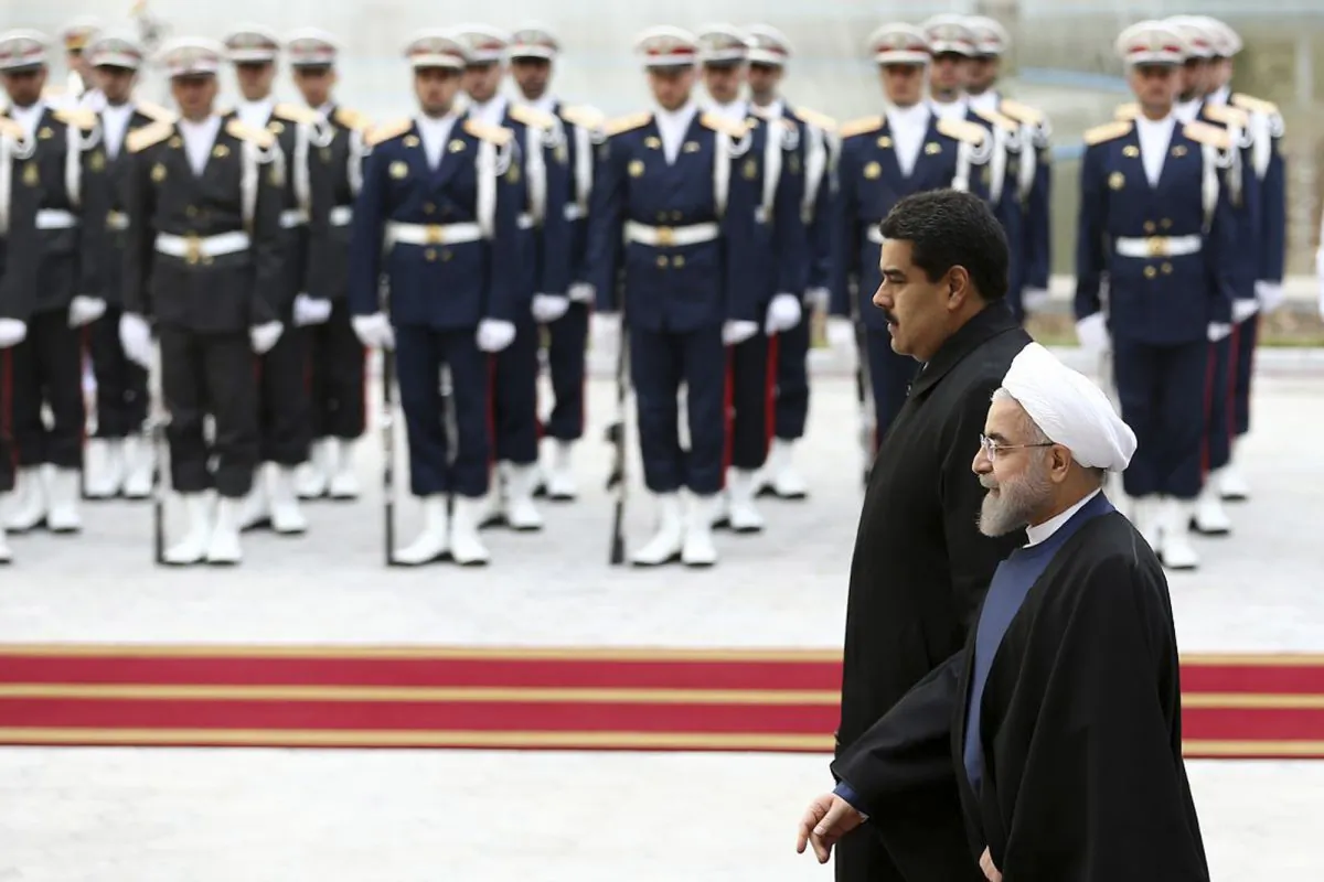 Venezuelan President Nicolas Maduro (L) is welcomed by his Iranian counterpart Hassan Rouhani during his official arrival ceremony at the Saadabad Palace in Tehran, Iran, on Saturday, Jan. 10, 2015.  (AP Photo/Iranian Presidency Office, Mohammad Berno)