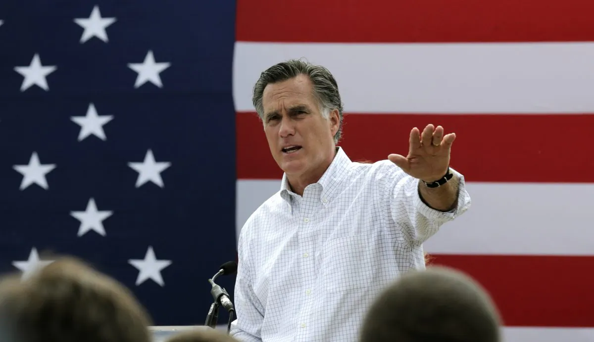 Mitt Romney, the former Republican presidential nominee, addresses a crowd of supporters while introducing New Hampshire Senate candidate Scott Brown at a farm in Stratham, N.H., on July 2, 2014.(AP Photo/Charles Krupa)