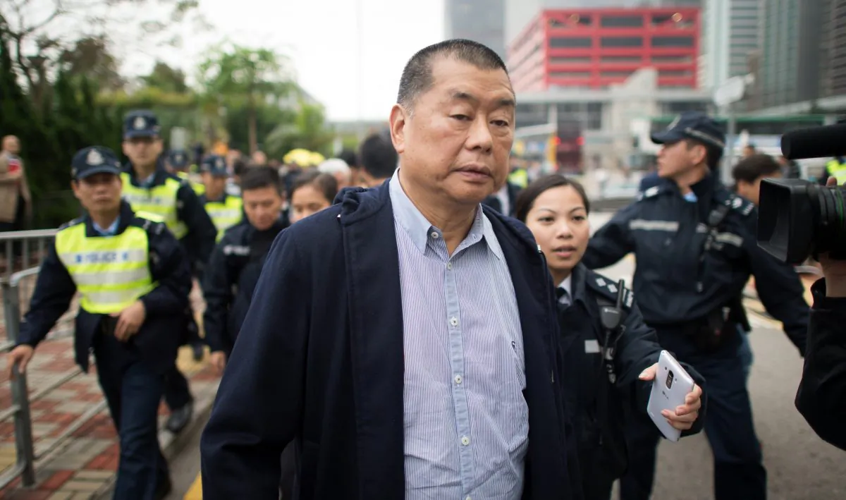 Hong Kong media tycoon and pro-democracy supporter Jimmy Lai leaves a police station in Hong Kong on Dec. 3, 2014. (Johannes Eisele/AFP/Getty Images)