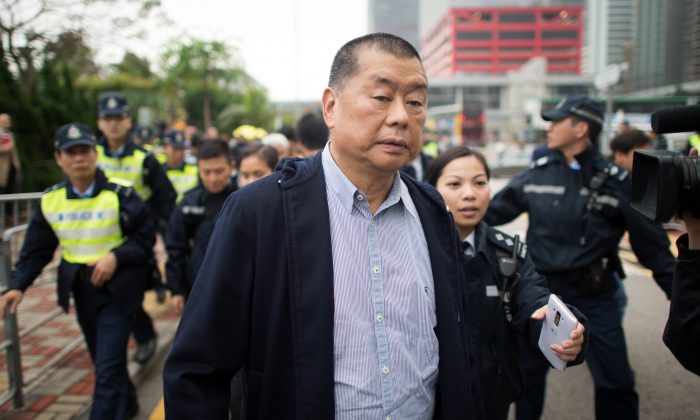 Hong Kong media tycoon and pro-democracy supporter Jimmy Lai leaves a police station in Hong Kong on Dec. 3, 2014. (Johannes Eisele/AFP/Getty Images)
