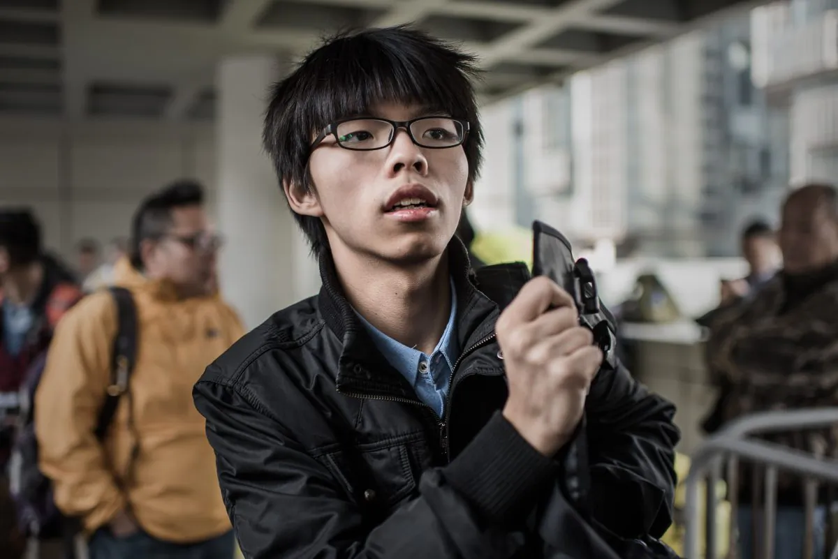 Hong Kong student activist Joshua Wong is pictured outside the High Court in Hong Kong on Jan. 8, 2015. (Philippe Lopez/AFP/Getty Images)