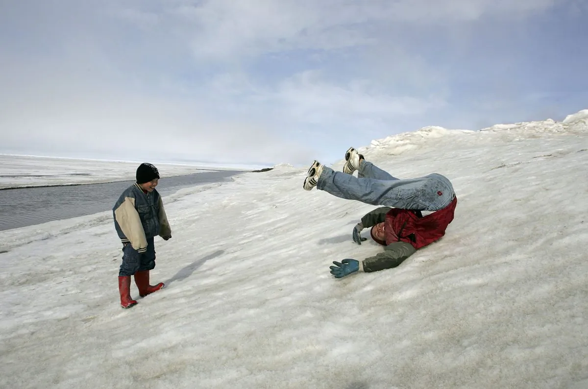 Inupiat Eskimo children play along the banks of the frozen Arctic Ocean in Browerville, Alaska, in this file photo. (Justin Sullivan/Getty Images)