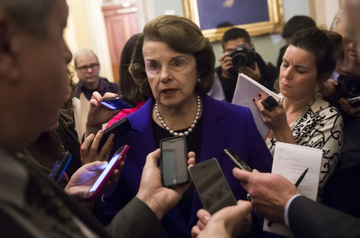 Senate Intelligence Chairwoman Dianne Feinstein (D-Calif.) (C) speaks to reporters about the committee's report on CIA interrogations at the U.S. Capitol on Dec. 9, 2014. (Saul Loeb/AFP/Getty Images)