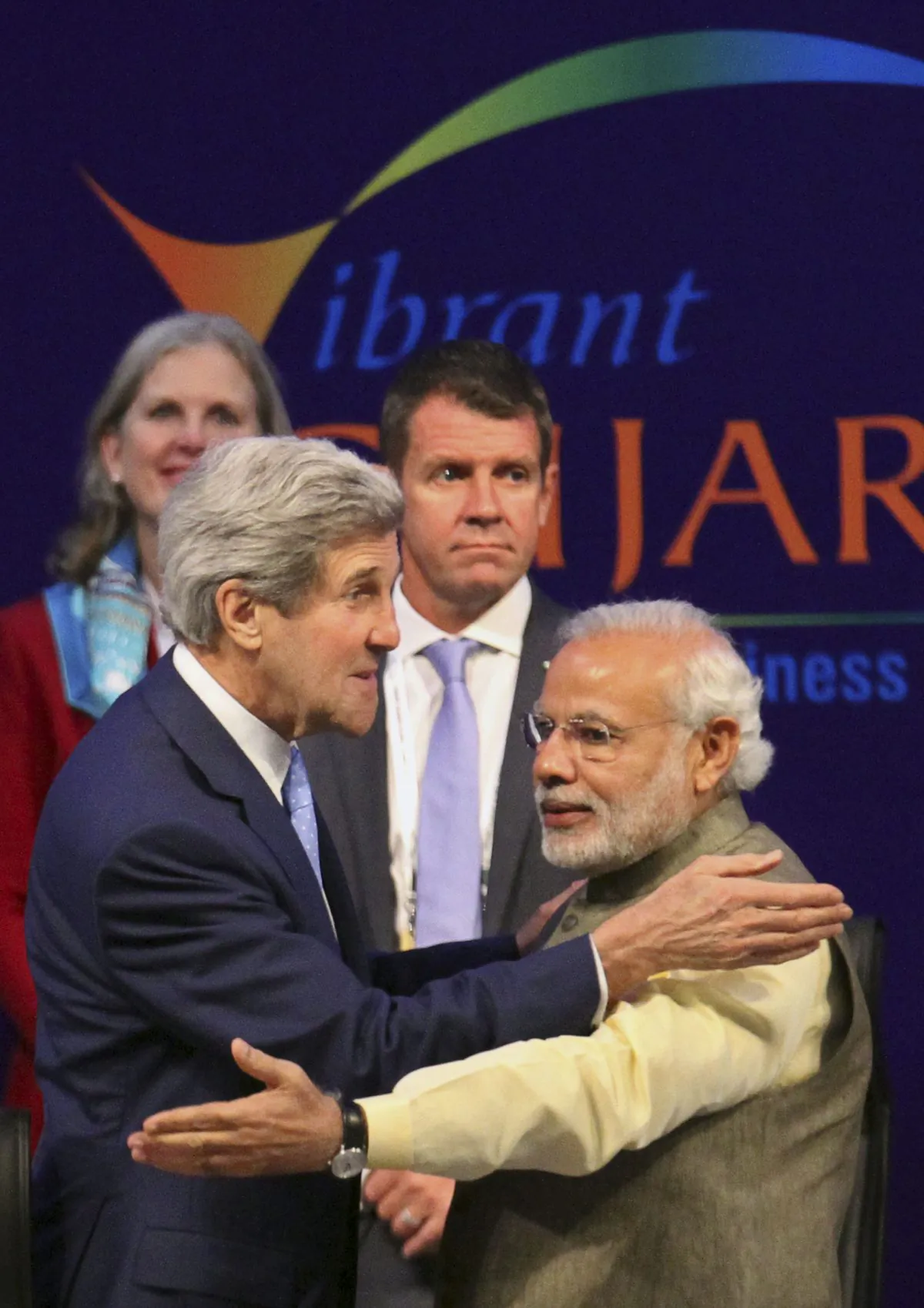 U.S. Secretary of State John Kerry, left, and Indian Prime Minister Narendra Modi greet each other at the Vibrant Gujarat summit in Gandhinagar, India, Sunday, Jan. 11, 2015. Kerry is in India to attend an international investment conference and push trade ties with the giant South Asian nation ahead of visit by President Barack Obama later this month. (AP Photo/Ajit Solanki)