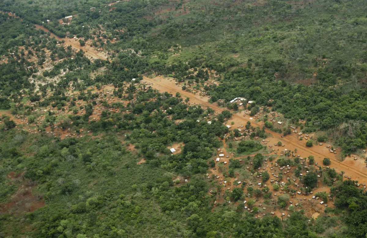 FILE - In this Sunday, April 29, 2012 file photo, the town of Obo, where U.S. special forces have paired up with local troops and Ugandan soldiers to seek out Joseph Kony's Lord's Resistance Army (LRA), is seen from the air in the Central African Republic. Uganda's government said Monday, Jan. 12, 2015, that it wants to try Lord's Resistance Army commander Dominic Ongwen, who recently surrendered to U.S. Forces and is in U.S. custody in Central African Republic, for war crimes and crimes against humanity, instead of at the International Criminal Court. (AP Photo/Ben Curtis, File)