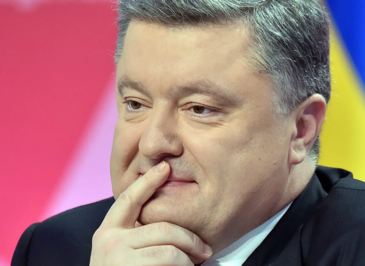Ukrainian President Petro Poroshenko thinks as he listens to a question during the annual press-conference in Kiev on Dec. 29, 2014. (Sergei Supinsky/AFP/Getty Images)