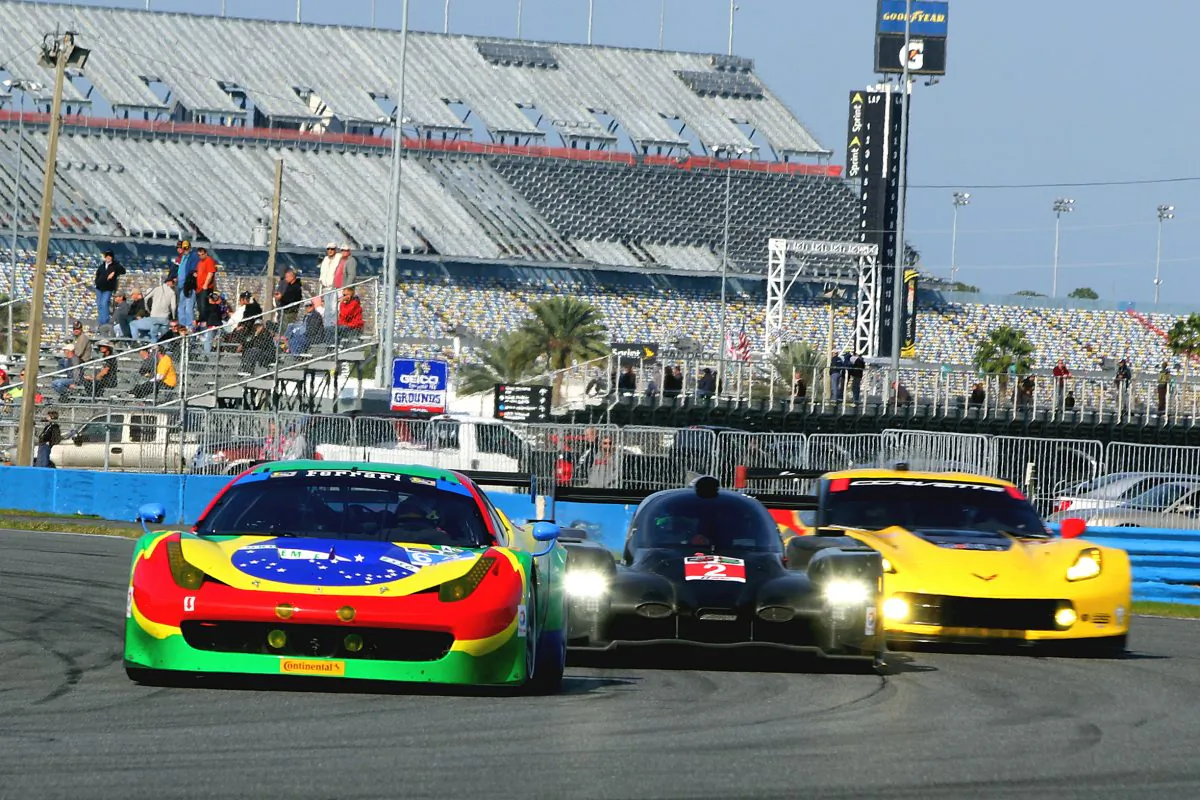 Mutli-class Racing: a GTD Ferrari, Prototype HPD-Honda, and GTLM Corvette fight for space around Daytona Speedway's International Horseshoe during the Tudor Championship Roar Before the 24, Jan. 9–11. (Chris Jasurek/Epoch Times)