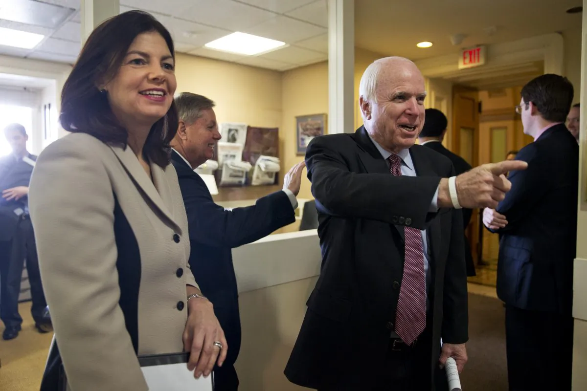 From left, Sen. Kelly Ayotte, R-N.H., Sen. Lindsey Graham, R-S.C., and Senate Armed Services Committee Chairman Sen. John McCain, R-Ariz., arrive before a news conference on Capitol Hill in Washington, Tuesday, Jan. 13, 2015, to discuss the federal prison at Guantanamo Bay, Cuba. (AP Photo/Jacquelyn Martin)