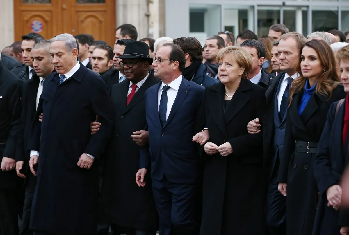 (L-R) Israeli Prime Minister, Benjamin Netanyahu; French President, Francois Hollande; and German Chancellor, Angela Merkel link arms during a unity march in Paris, France on Jan. 11, 2015, following terrorist attacks in the French city last week. (Dan Kitwood/Getty Images)