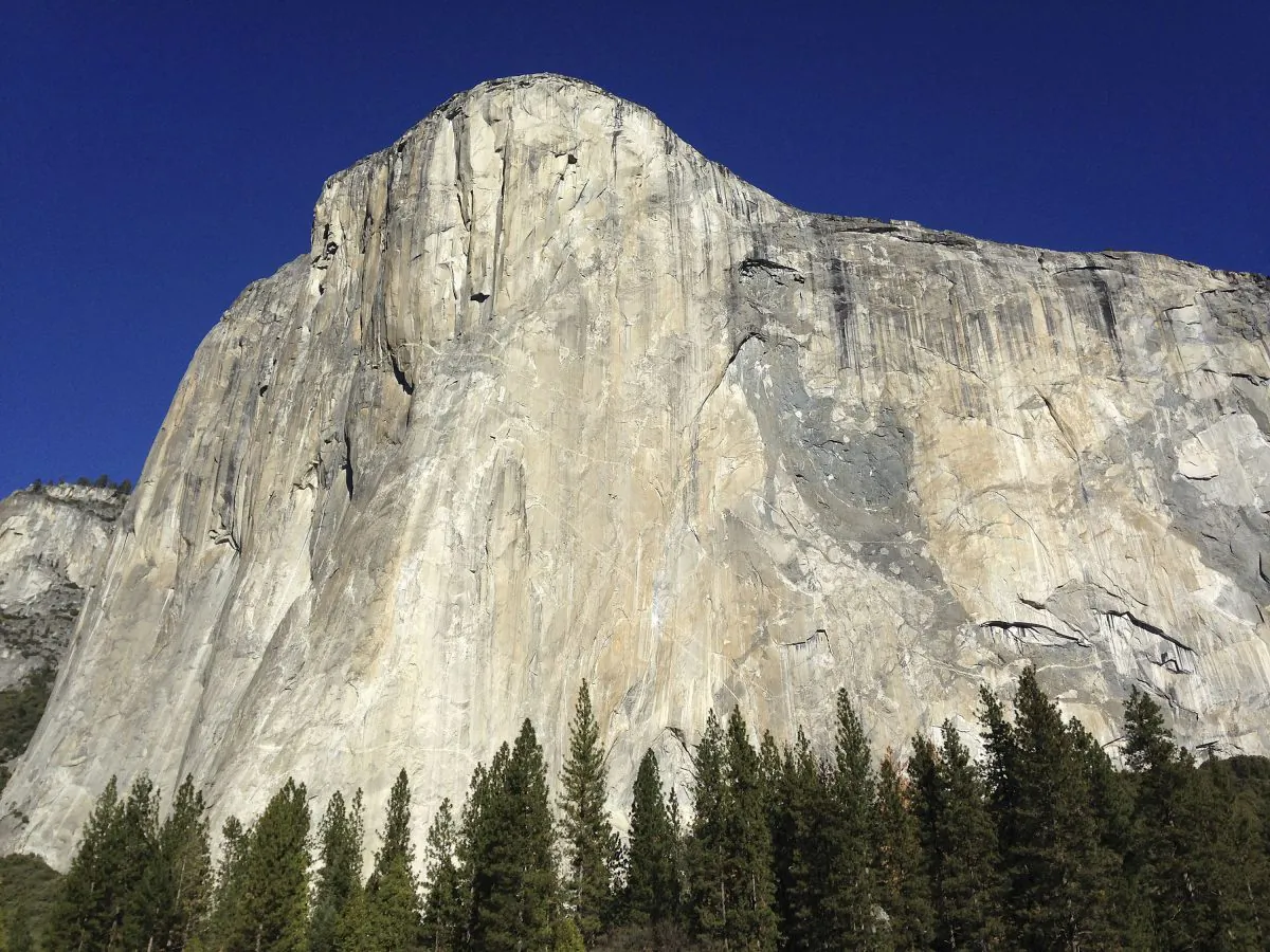 Shown is El Capitan where two climbers vying to become the first in the world to use only their hands and feet to scale a sheer slab of granite make their way to the summit Wednesday, Jan. 14, 2015, in Yosemite National Park, Calif. The pair are closing in on the top of the 3,000-foot peak and if all goes as planned, 30-year-old Kevin Jorgeson of California and 36-year-old Tommy Caldwell of Colorado, should complete their climb early Wednesday afternoon. (AP Photo/Ben Margot)
