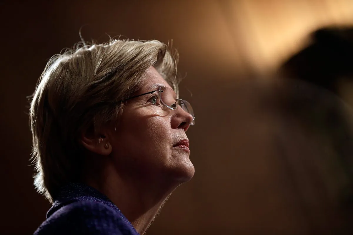 Sen. Elizabeth Warren (D-Ma.) listens as Consumer Financial Protection Bureau Director Richard Cordray testifies before the Senate Banking, Housing and Urban Affairs Committee Nov. 12, 2013, in Washington, DC. (Win McNamee/Getty Images)