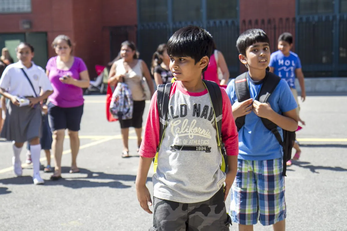 Boys at P.S. 234 after their first day of school in Astoria, New York, Sept. 4, 2014. (Samira Bouaou/Epoch Times)