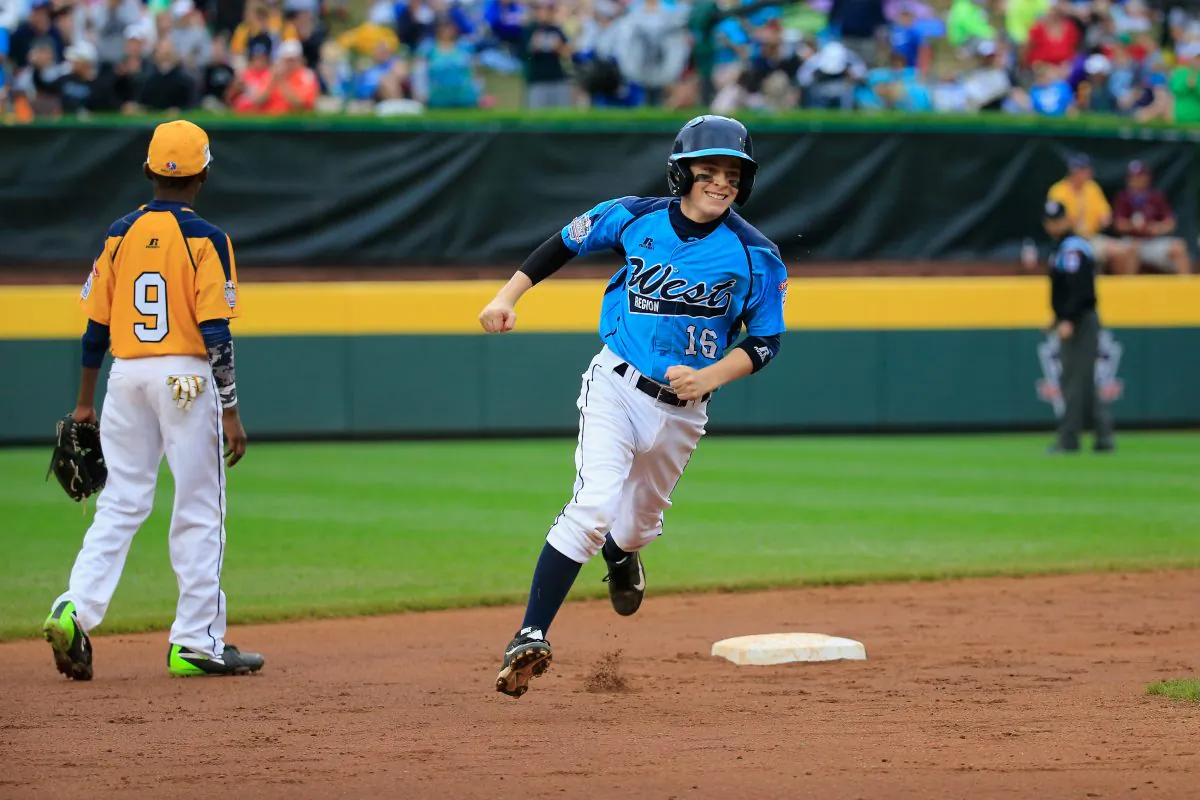 Brad Stone 16 of the West Team from Las Vegas rounds the bases after hitting a home run against the Great Lakes Team from Chicago during the United States Championship game of the Little League World Series in South Williamsport, Pa., on Aug. 23, 2014. (Rob Carr/Getty Images)