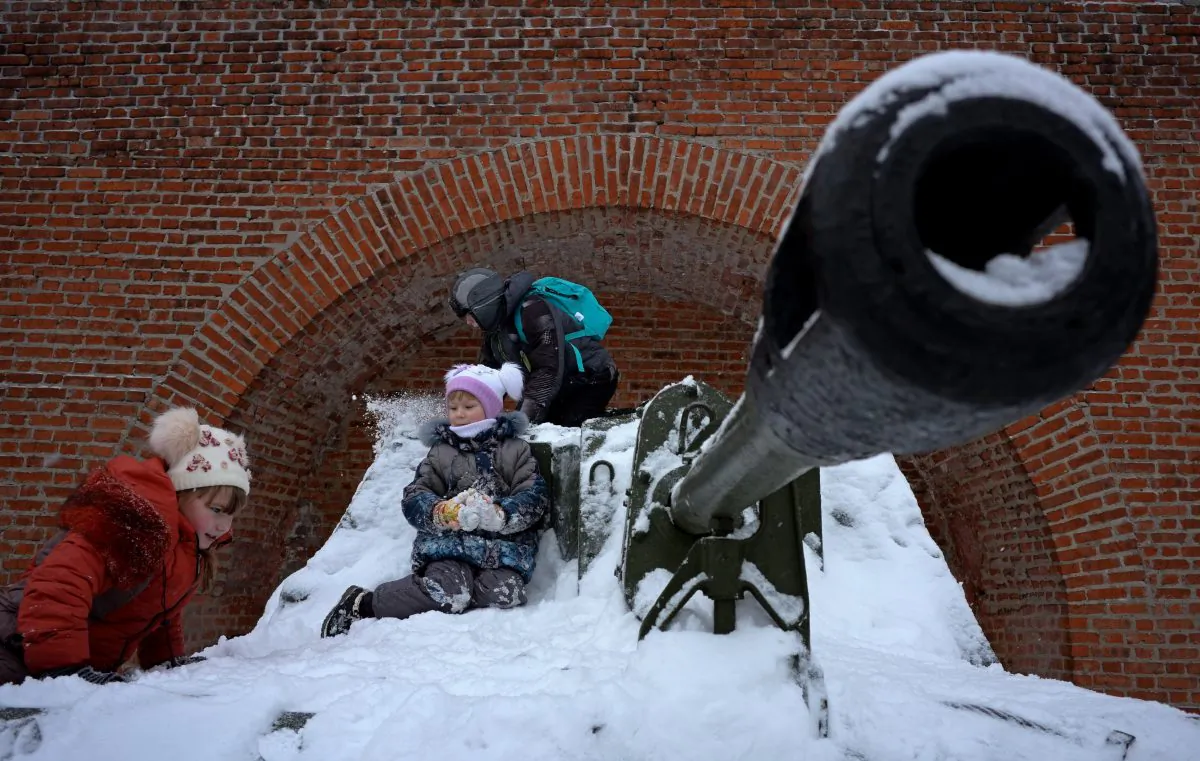 Children play in the snow atop a self-propelled SU-76 tank at a local military museum in the city of Nizhny Novgorod, about 270 miles from Moscow, on Jan. 11, 2015. (Kirill Kudryavtsev/AFP/Getty Images)