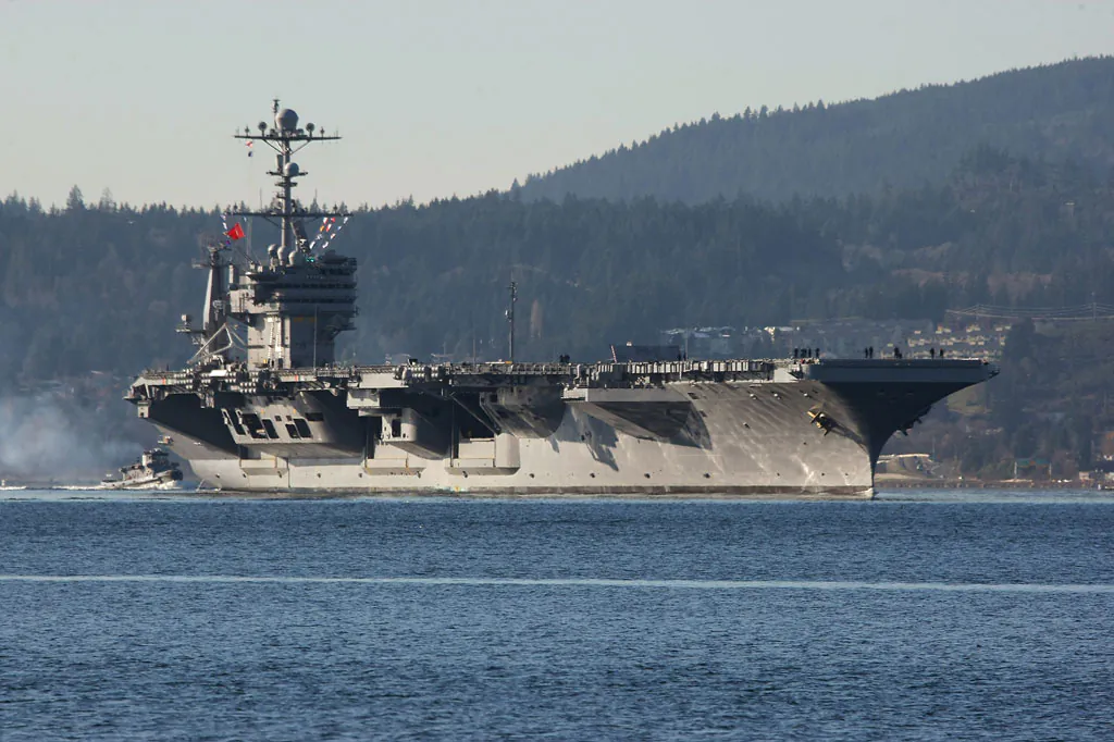 The aircraft carrier USS John Stennis near Bremerton, Wash., on Dec. 1, 2014. On Monday, Jan. 12, 2015, the ship sailed from Naval Base Kitsap in Bremerton, Wash., to Naval Magazine Indian Island, Wash., in order to take on ammunition before a training mission in the Pacific Ocean near San Diego, Calif. (AP Photo/Kitsap Sun, Larry Steagall)
