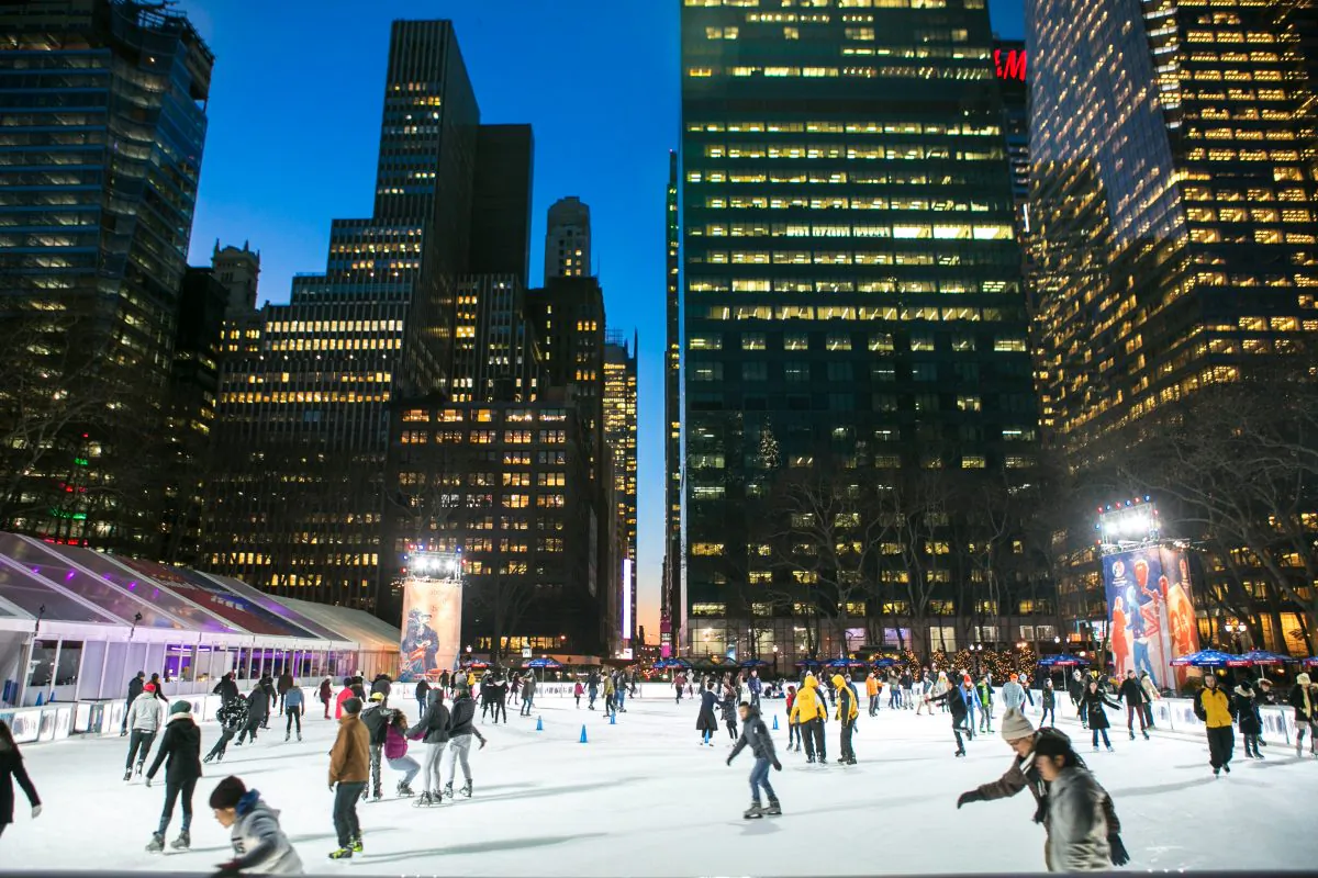 People ice skate at Bryant Park on Jan. 13, 2015 in New York, which will be open to the public for free until March. 1. (Benjamin Chasteen/Epoch Times)