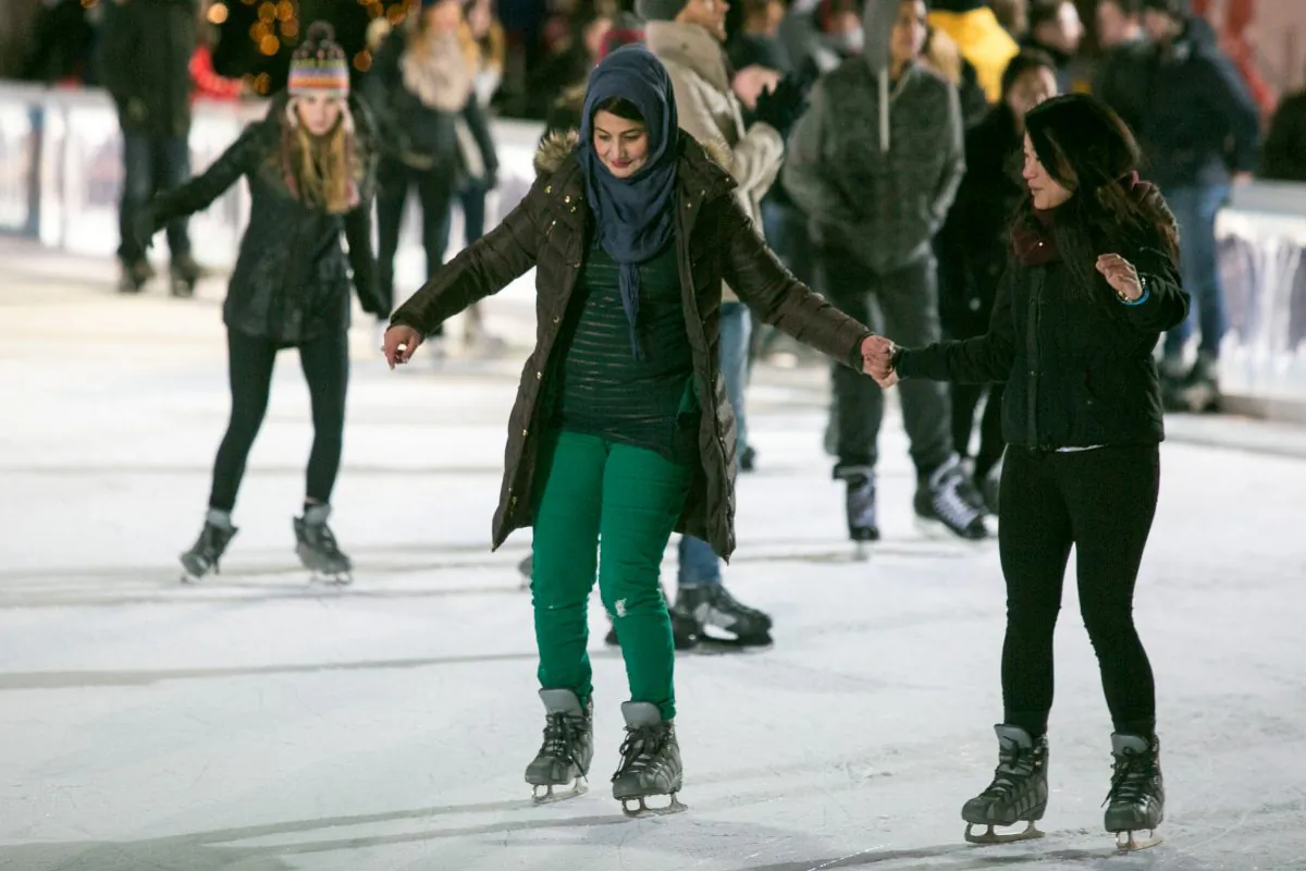 People ice skate at Bryant Park on Jan. 13, 2015 in New York, which will be open to the public for free until March. 1. (Benjamin Chasteen/Epoch Times) 