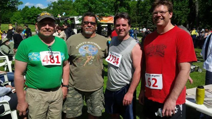 Brad Franck (2nd R) poses with three other members of Better Fathers on June 7, 2014, after completing Run for Rights, an annual event in support of Winnipeg organizations working for social justice and human rights. (Better Fathers Inc.)
