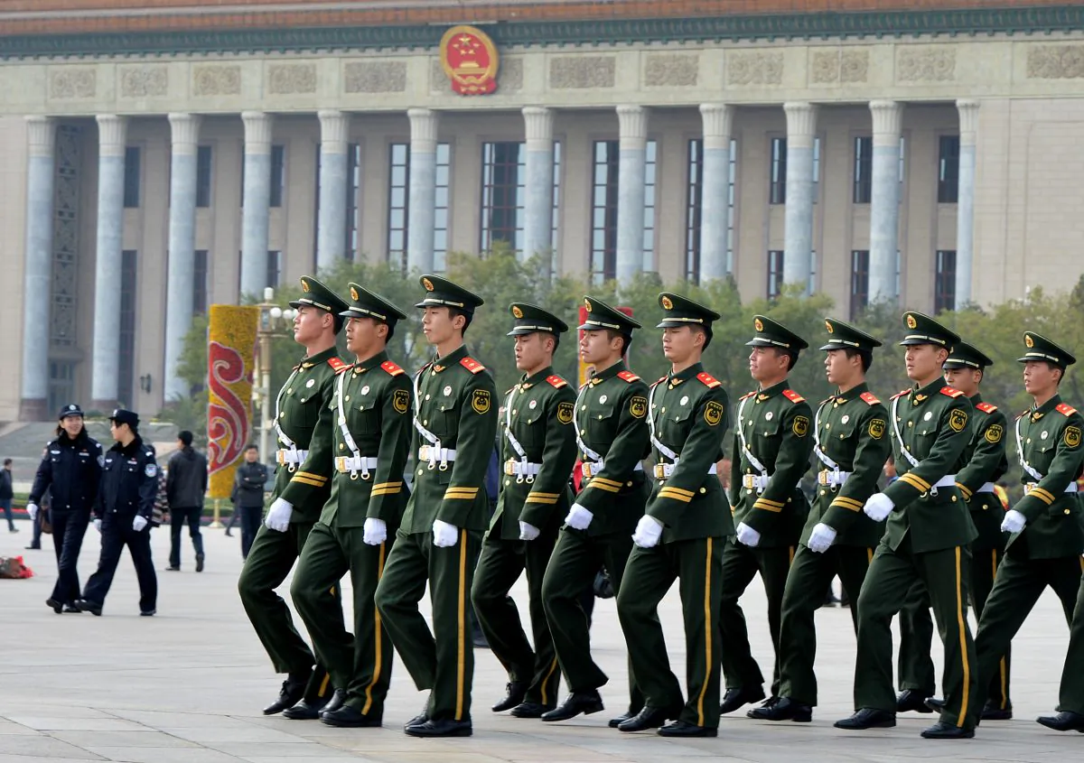In this file photo paramilitary police march through Tiananmen Square in Beijing on Nov. 7, 2012. (Mark Ralston/AFP/Getty Images)