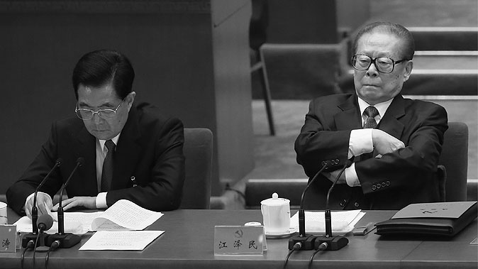 Former Chinese communist leader Jiang Zemin (R) attends the closing session of the 18th National Congress of the Chinese Communist Party on Nov. 14, 2012, in Beijing. Jiang is believed to be the ultimate godfather behind the plotting of Bo Xilai and Zhou Yongkang. (Feng Li/Getty Images)