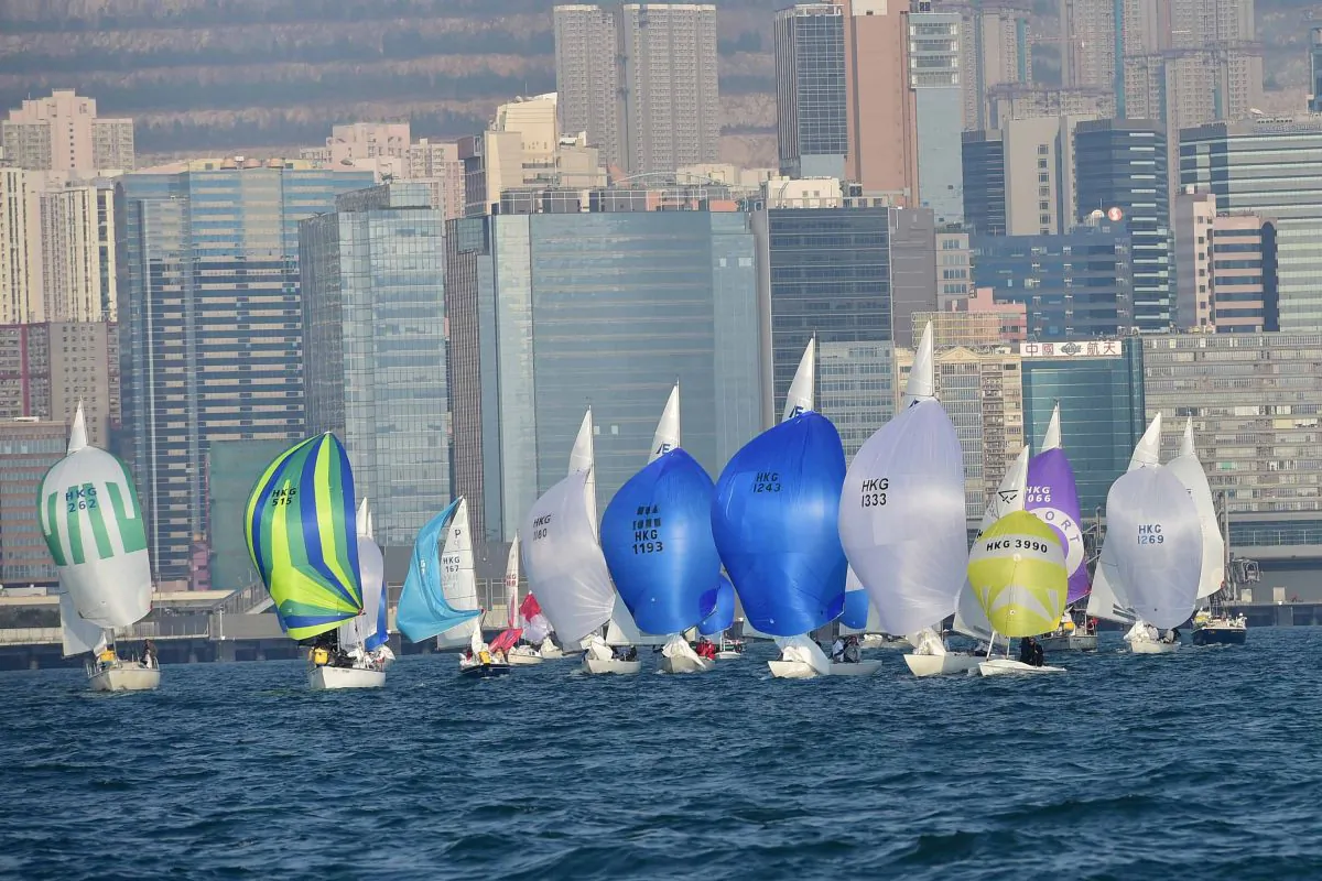 Boats of different classes, sailing down-wind to the Kowloon Bay Mark during the RHKYC Tomes Cup event on Saturday Jan 10, 2015. (Bill Cox/Epoch Times)
