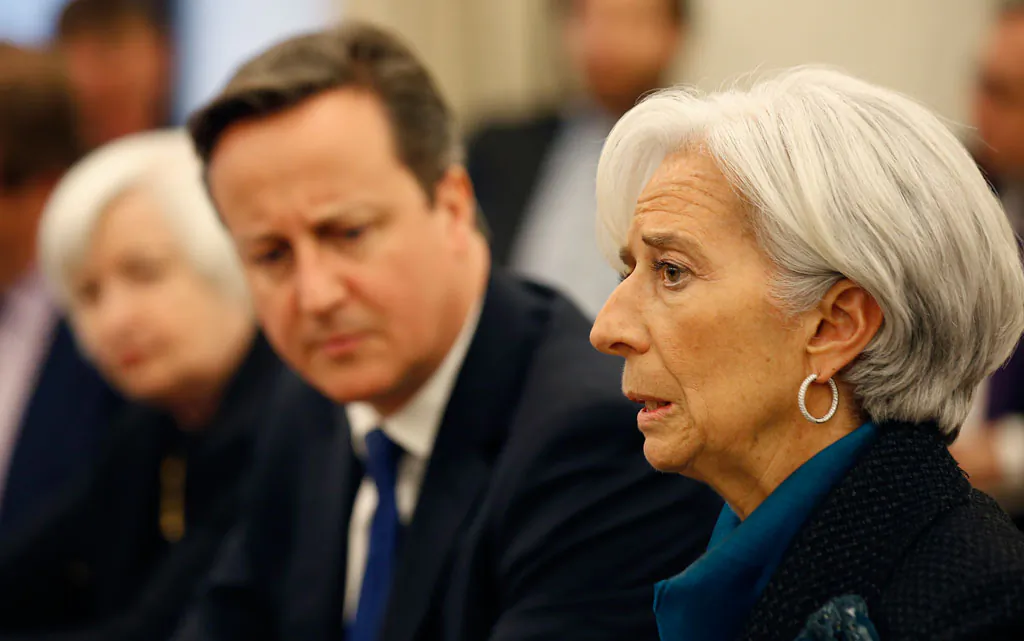 Federal Reserve Chair Janet Yellen (L) listens with British Prime Minister David Cameron, as International Monetary Fund (IMF) Managing Director Christine Lagarde, speaks during a round table meeting at the IMF, Thursday, Jan. 15, 2015 in Washington. (AP Photo/Alex Brandon)