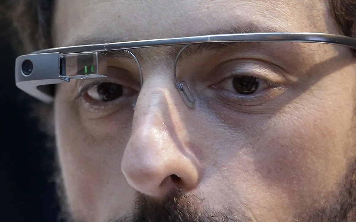 Google co-founder Sergey Brin wears a Google Glass device in San Francisco on Feb. 20, 2013. Google on Thursday, Jan. 15, 2015, announced it will stop selling its Internet-connected eyewear to consumers until the company can develop a more polished and affordable version that's less likely to be viewed as a freakish device. (AP Photo/Jeff Chiu)
