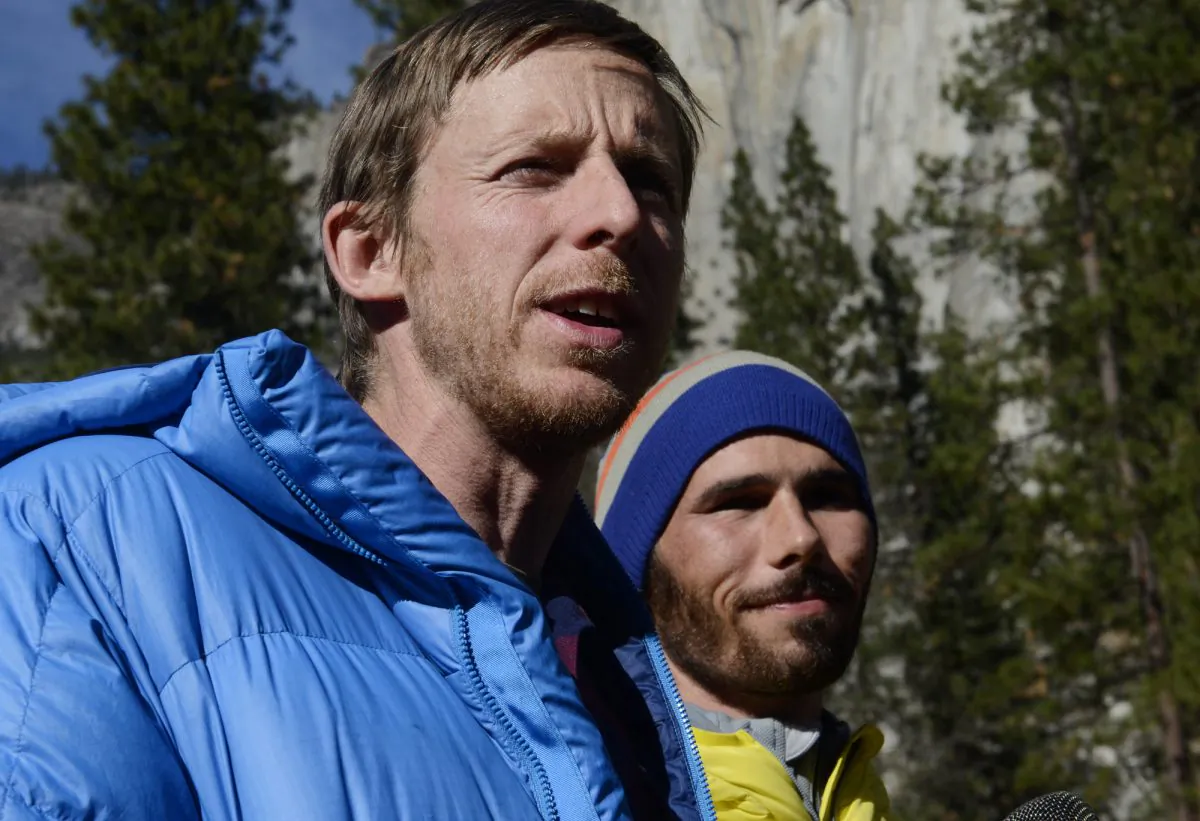 Climbers Tommy Caldwell (L) and Kevin Jorgeson (R) speak during a press conference in Yosemite Valley near the base of El Capitan Thursday morning, Jan. 15, 2015, in Yosemite National Park, Calif. The two Americans became the first to free-climb El Capitan's Dawn Wall. They used ropes and safety harnesses in case of a fall but relied only on their hands, feet and strength to reach the 3,000-foot summit the day before. The trek began Dec. 27. (AP Photo/The Fresno Bee, Eric Paul Zamora)