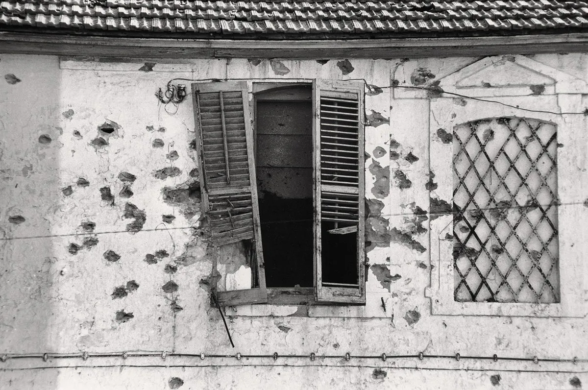 Bullet holes in a façade, Cyprus, 1974. (Jean Mohr/Musée de l’Elysée)
