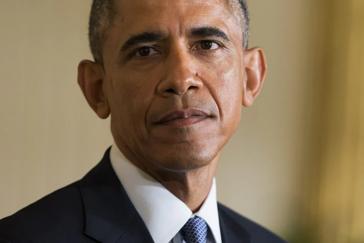 President Barack Obama listens as British Prime Minister David Cameron speaks during their joint news conference in the East Room of the White House in Washington, Friday, Jan. 16, 2015. (AP Photo/Evan Vucci)
