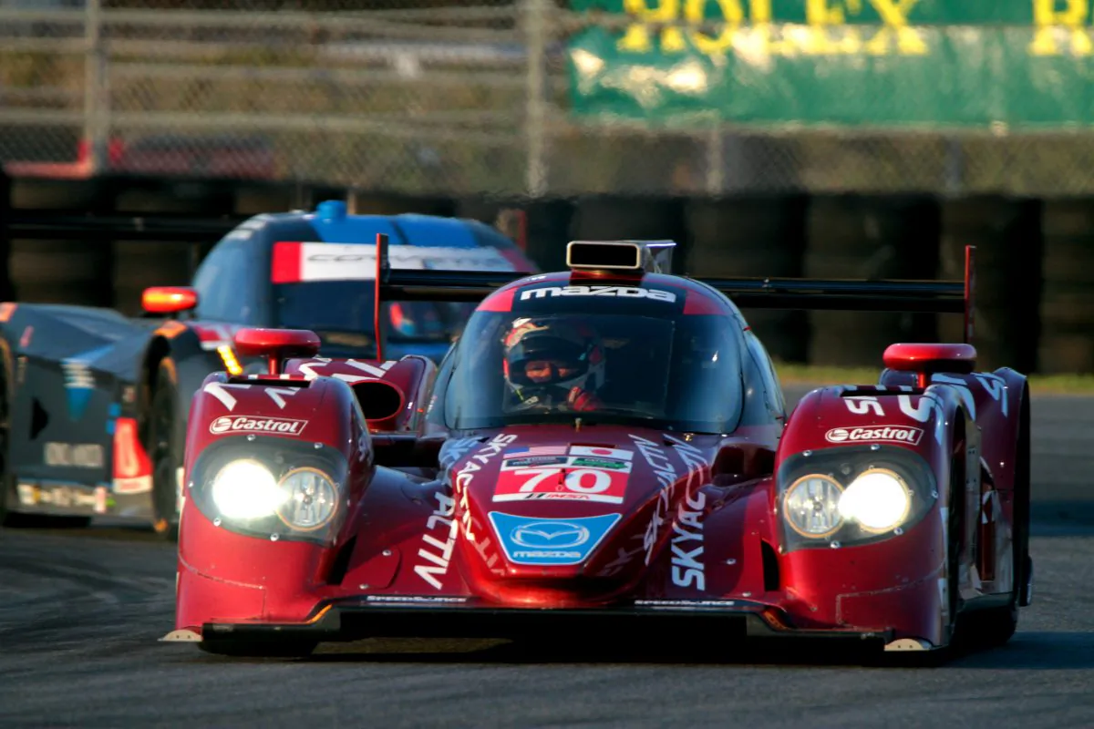 The #70 Mazda diesel leads the #10 WTR Dallara-Corvette through the East Horseshoe at Daytona International Speedway during the Tudor Championship Roar Before the 24, Jan. 10, 2015. (Chris Jasurek/Epoch Tiimes)