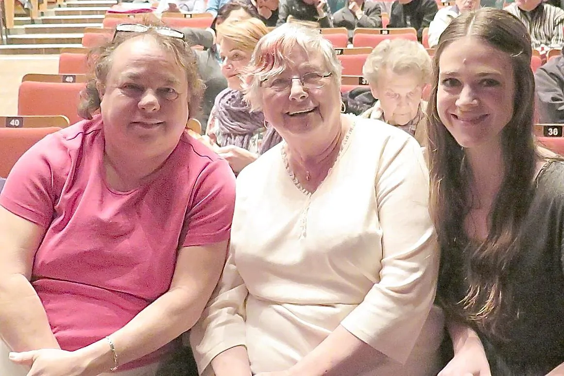 Julie MacRae (R) and family members attend Shen Yun Performing Arts at Queen Elizabeth Theatre in Vancouver on Jan. 17, 2015. (Christina Liao/Epoch Times)