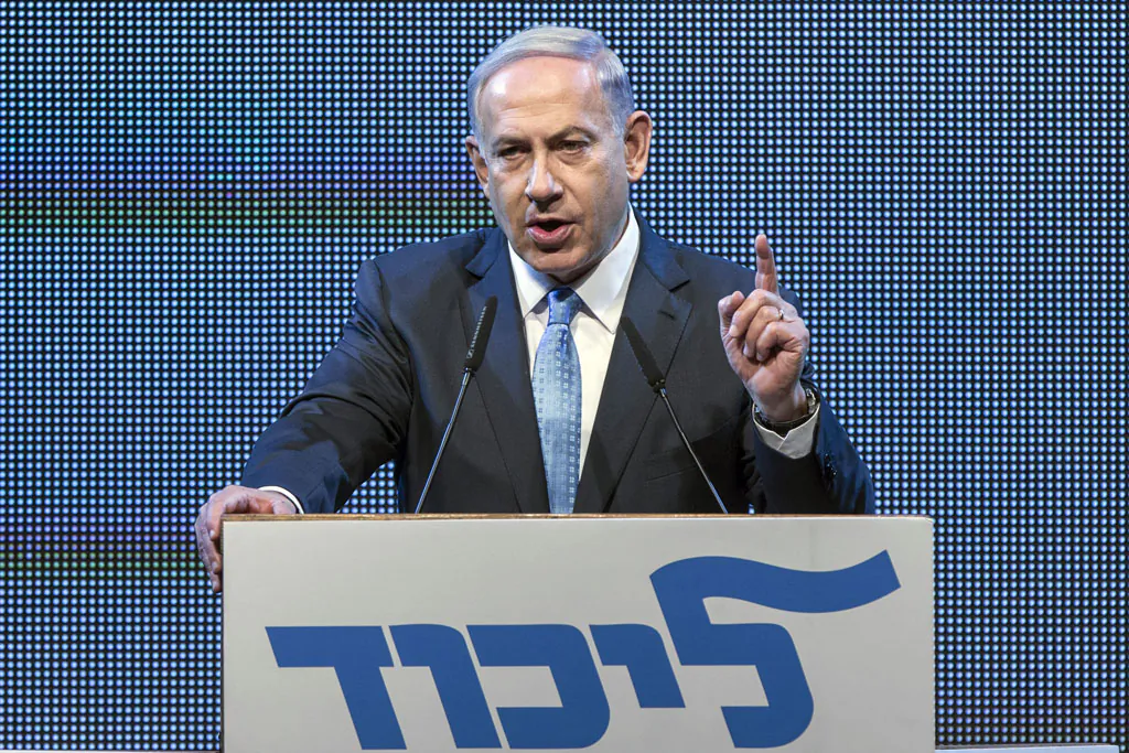 Israeli Prime Minister and leader of the ruling right-wing Likud party, Benjamin Netanyahu gives a speech during a campaign meeting ahead of the early elections for the 20th Knesset on Jan. 5, 2014, in the coastal Israeli city of Tel Aviv. (Jack Guez/AFP/Getty Images)
