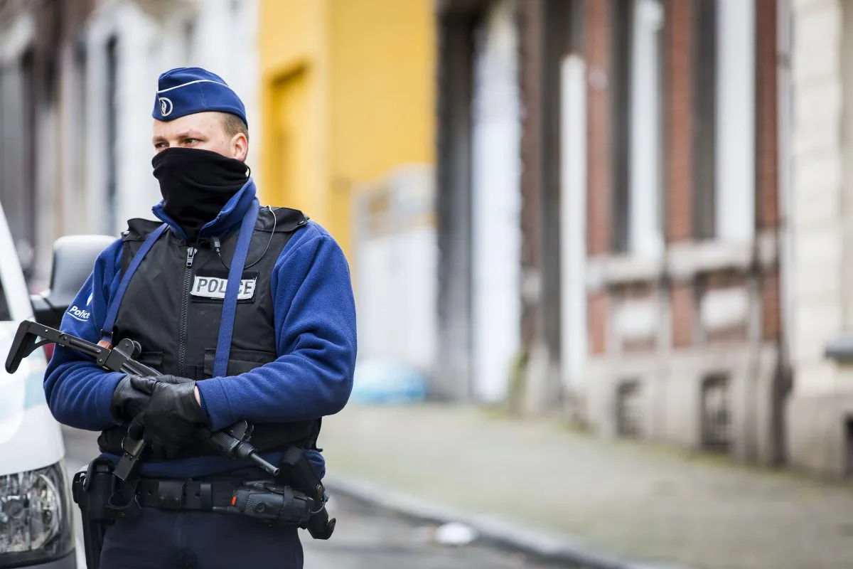 An armed Belgian police officer patrols Colline Street in Verviers, eastern Belgium, on Jan. 16, 2015, one day after two suspected jihadists were killed in a police raid. (Valerie Kuypers/AFP/Getty Images)