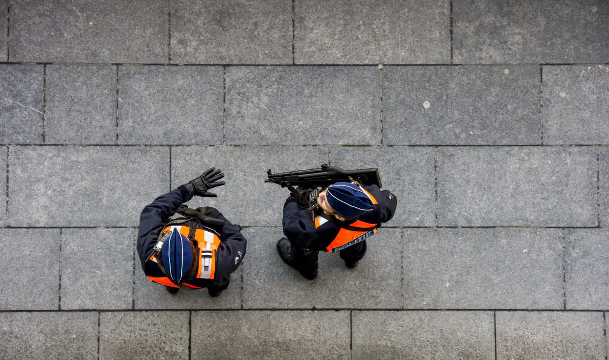 Policemen patrol near the courthouse on Bolivar Square in Antwerp, Belgium, on Jan. 16, 2015, the day after an anti-terrorist operation. (Marco de Swart/AFP/Getty Images)